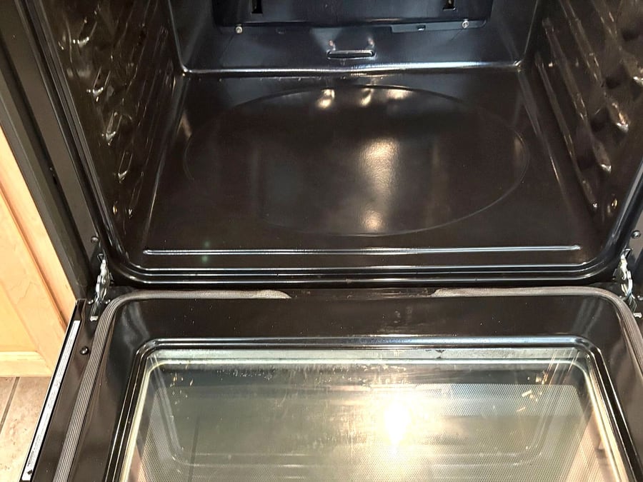 The same oven interior scrubbed clean after our move-out clean