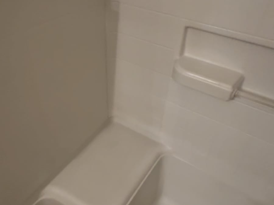 The same shower seat scrubbed clean after our deep clean