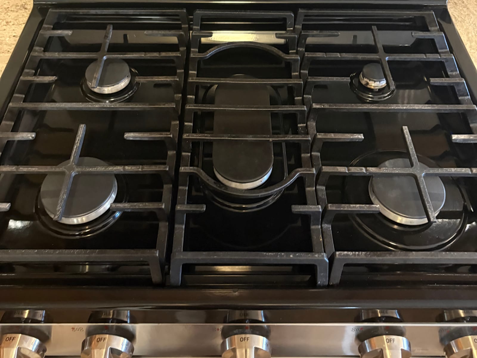 Same gas stove degreased and polished after our house cleaning