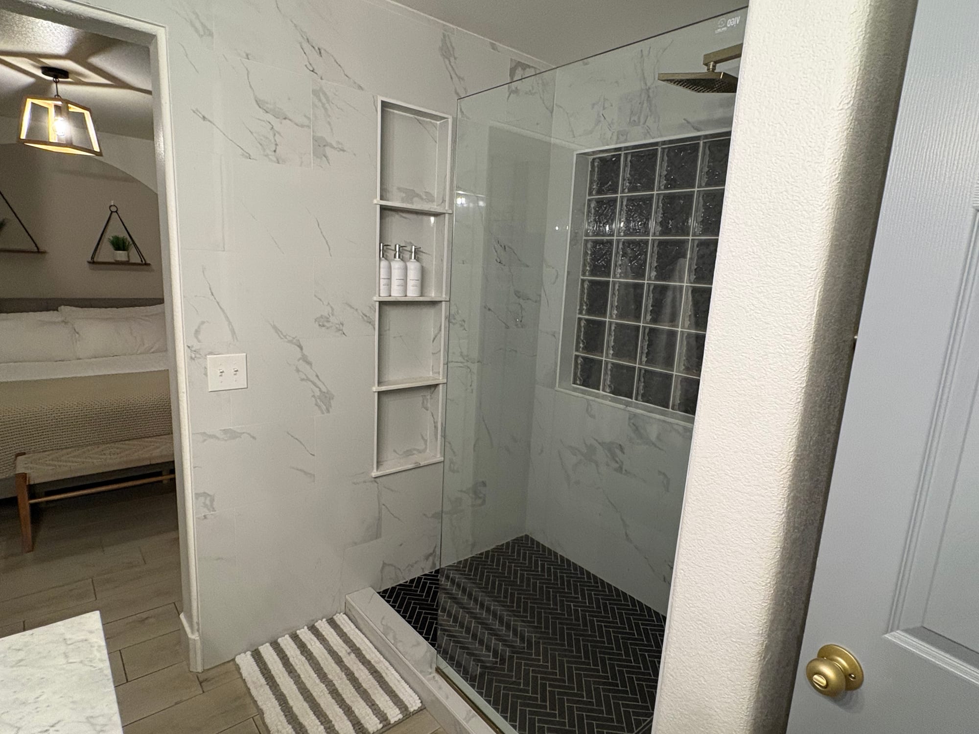 Marble walk-in shower scrubbed and reset after a Queen Creek turnover clean