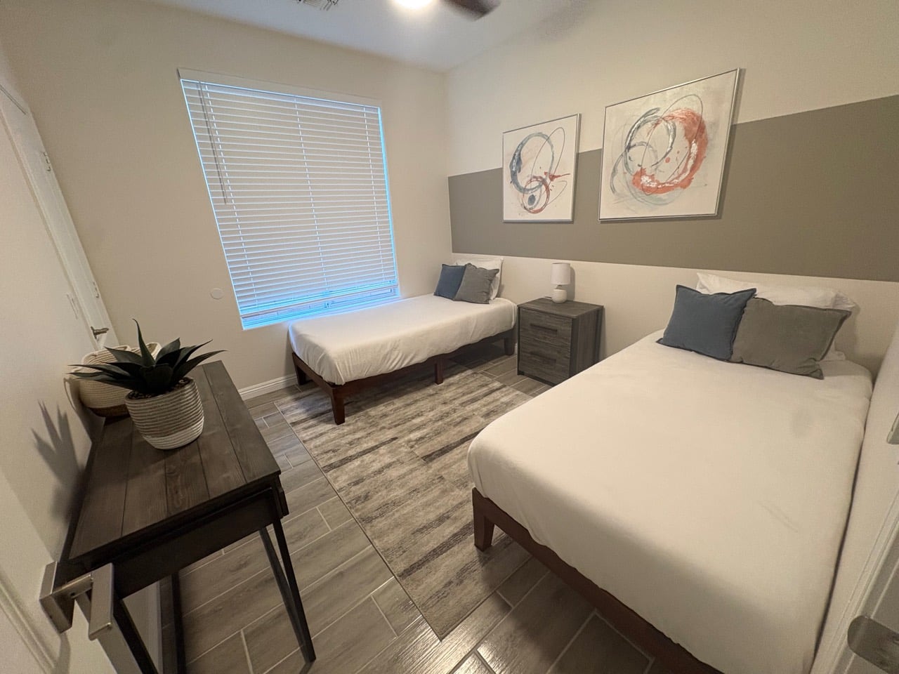 Twin-bed guest room made up for a family stay after a turnover clean