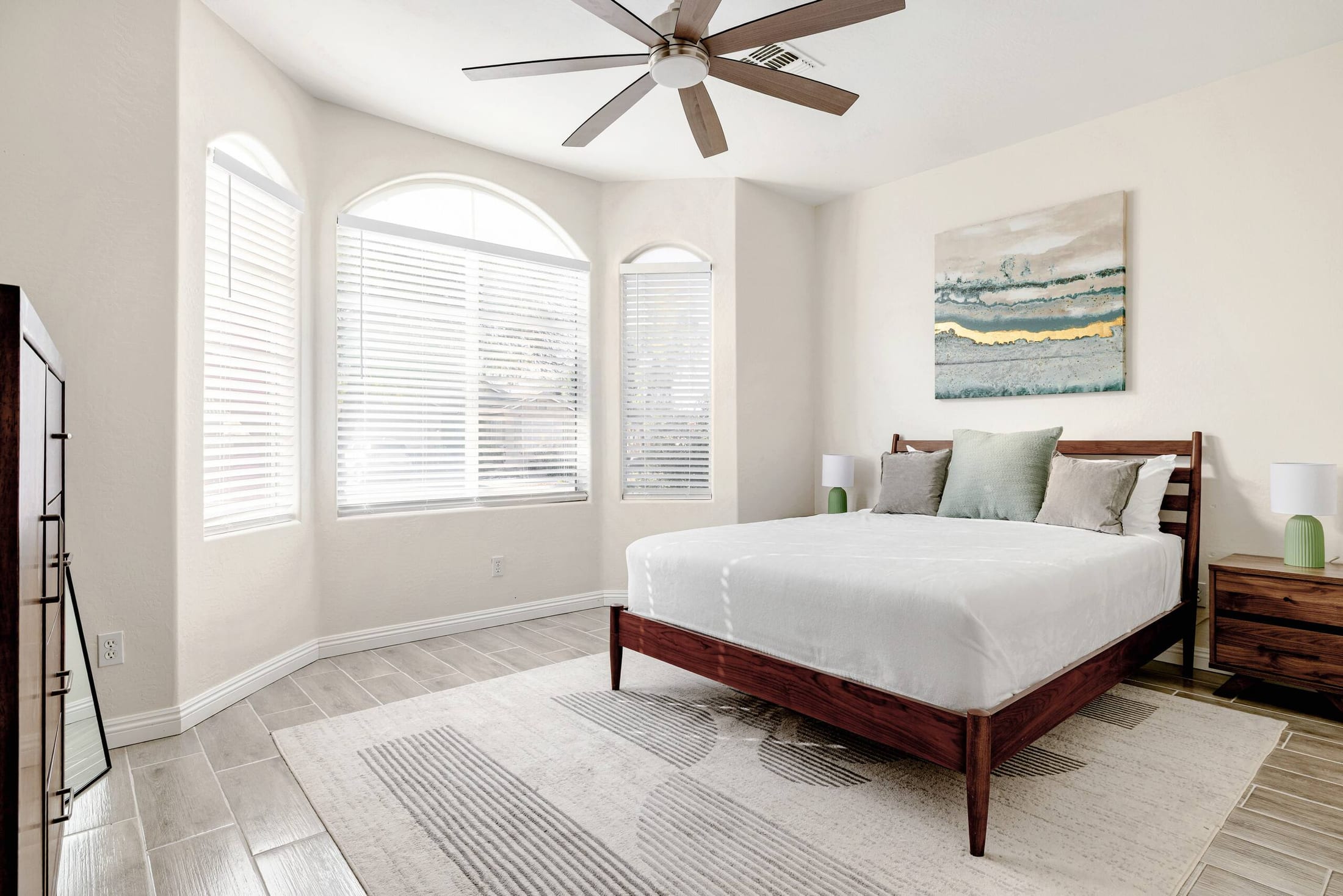 Primary bedroom made guest-ready in a vacation rental we clean