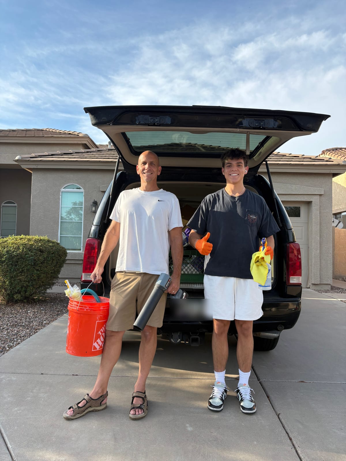 Mason and his dad, the HandymanCleaners father-and-son team, loading cleaning gear in San Tan Valley